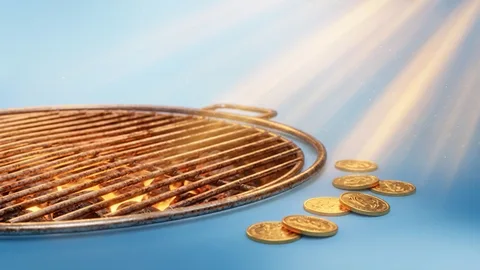 Tragamonedas con una parrilla encendida y monedas de oro