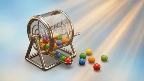 Jaula de bingo con bolillas de colores y un cartón marcado
