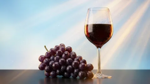 Tragamonedas con uvas moradas y una copa de vino